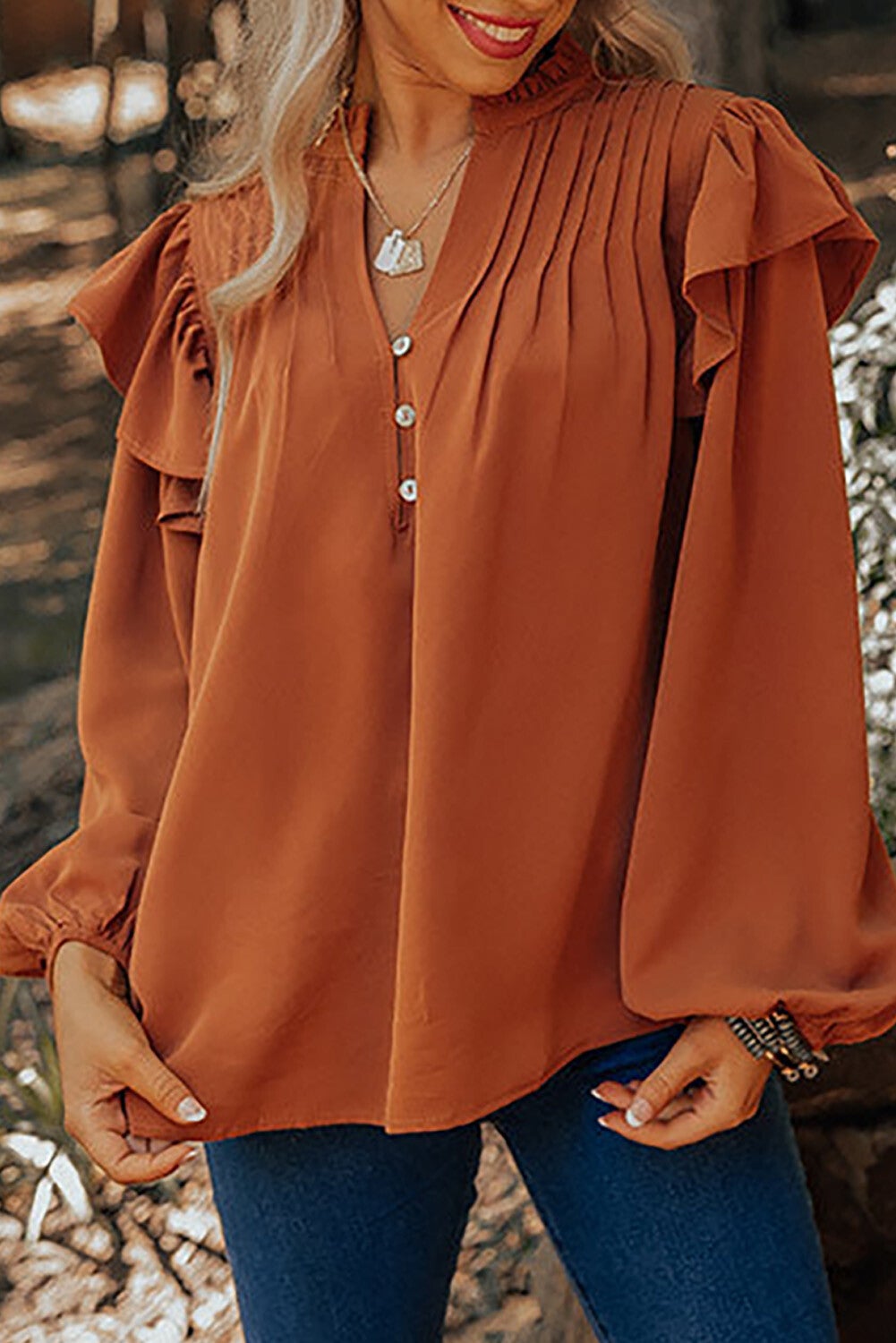 Blusa con volantes plisados